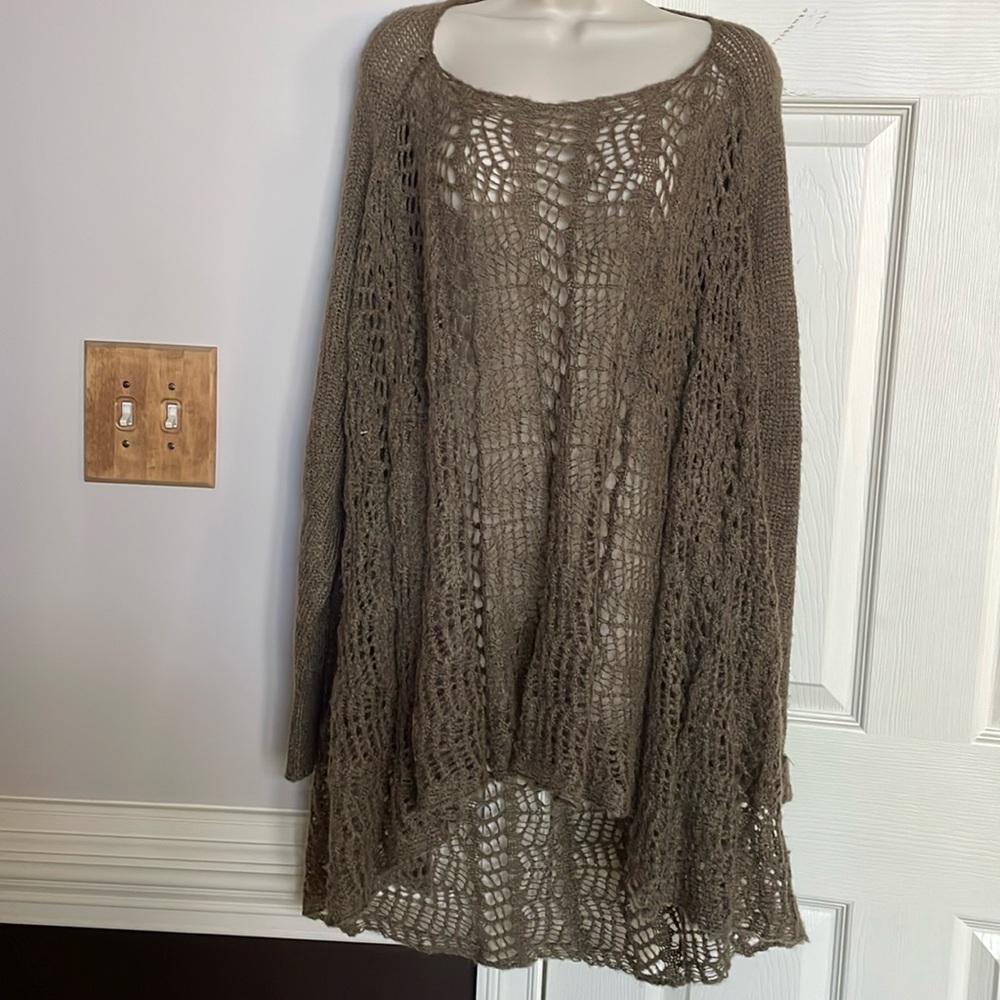Elegant design with crochet sweater. Longer in back for women